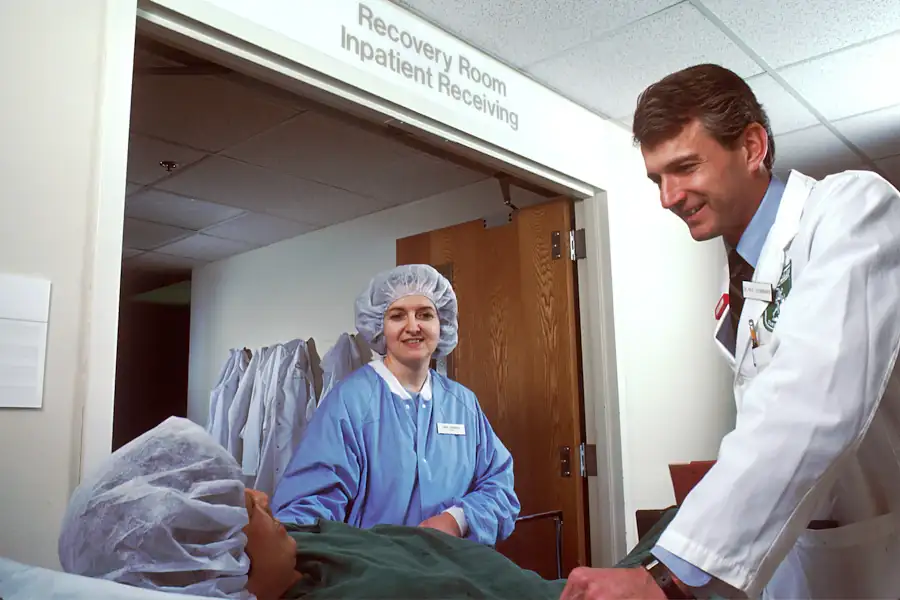 A clinician with a patient